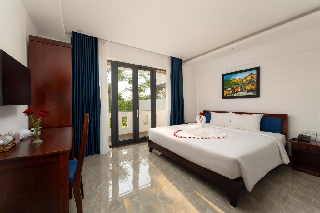 Giường trong phòng chung tại May Boutique Villa Hội An