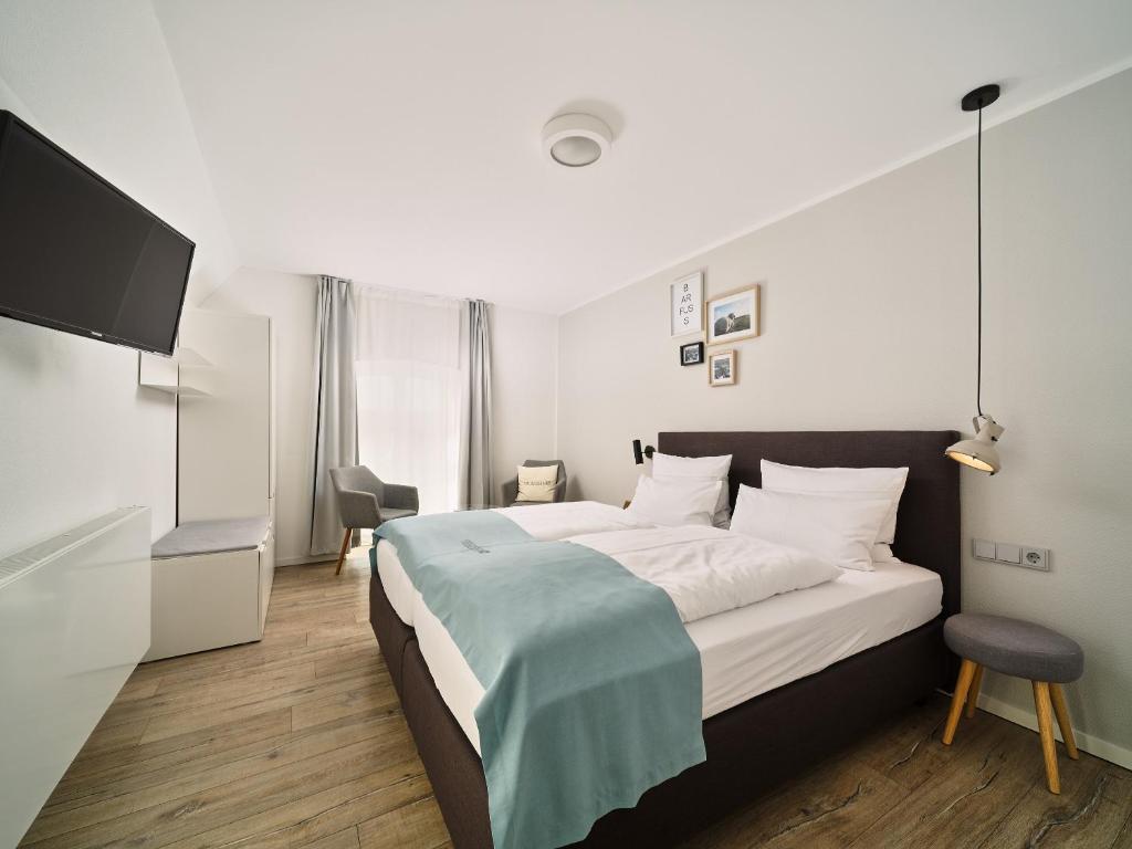 Postel nebo postele na pokoji v ubytování Hotel Siebzehn80