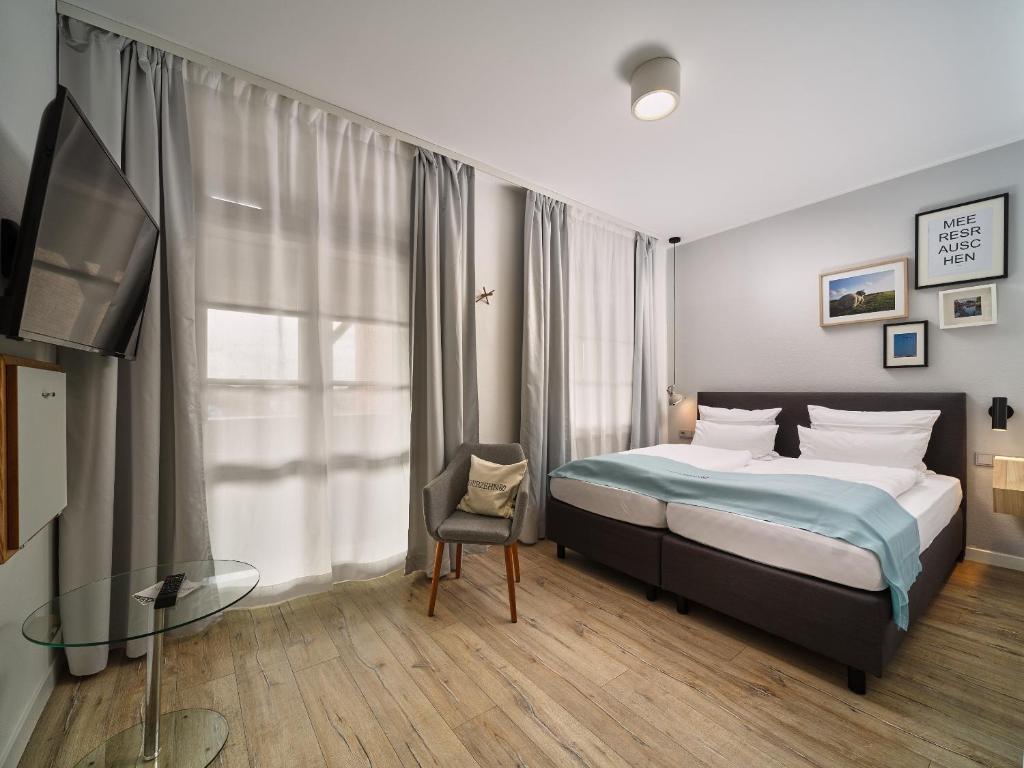 Postel nebo postele na pokoji v ubytování Hotel Siebzehn80