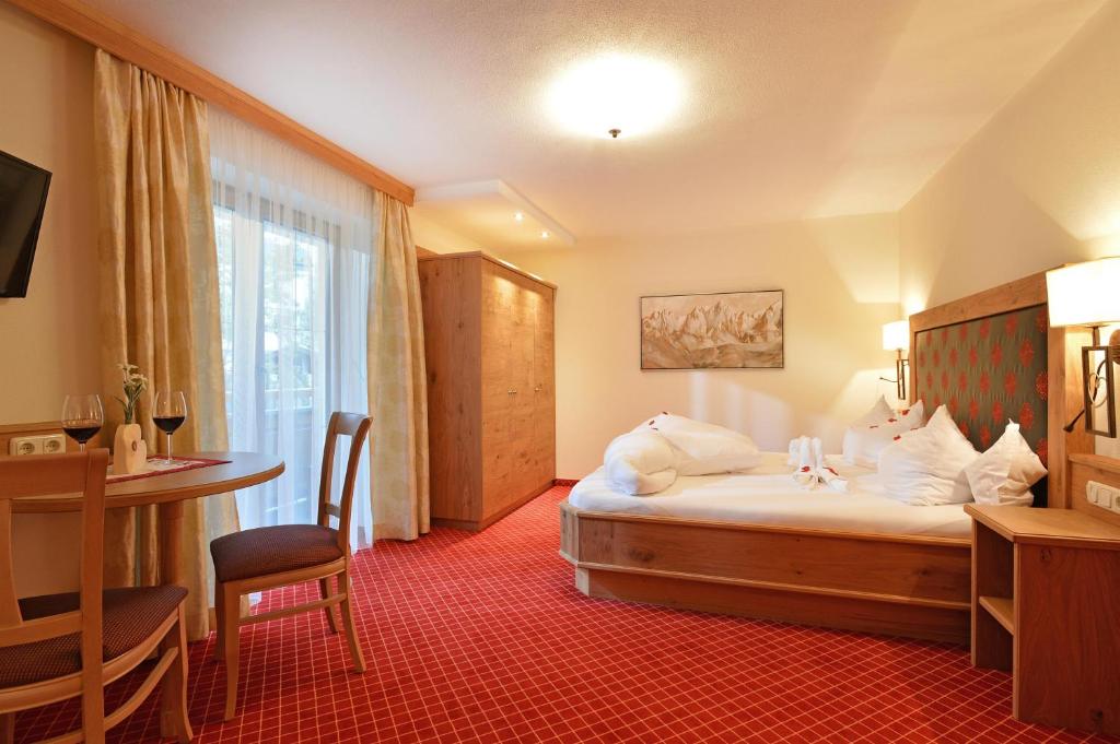 Voodi või voodid majutusasutuse Hotel Garni Bavaria toas