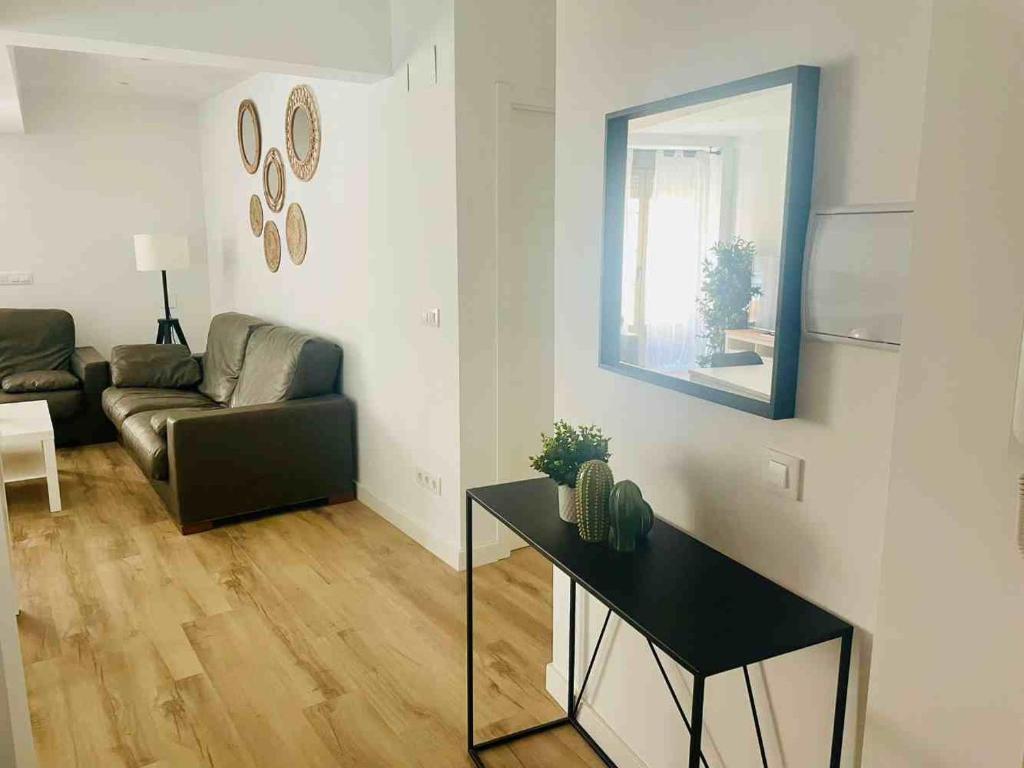 a living room with a couch and a table at Casa Carmela in Fuenmayor