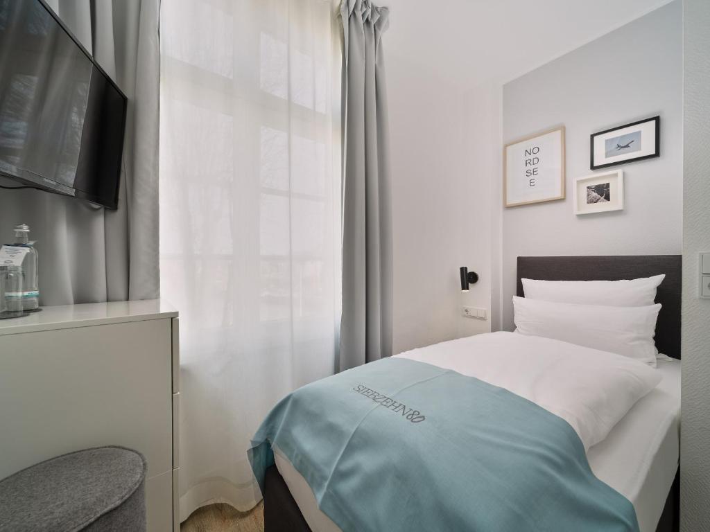Postel nebo postele na pokoji v ubytování Hotel Siebzehn80
