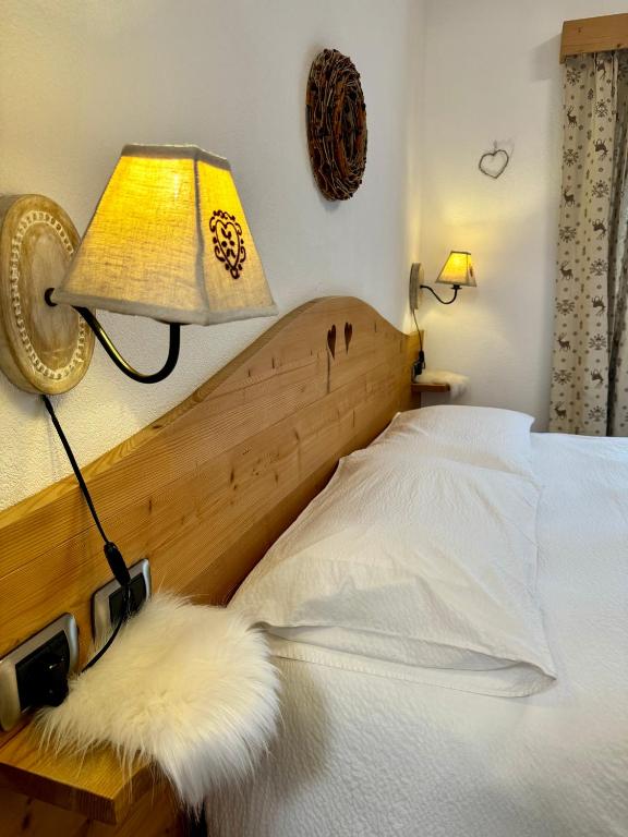 Postel nebo postele na pokoji v ubytování La Rosa Home