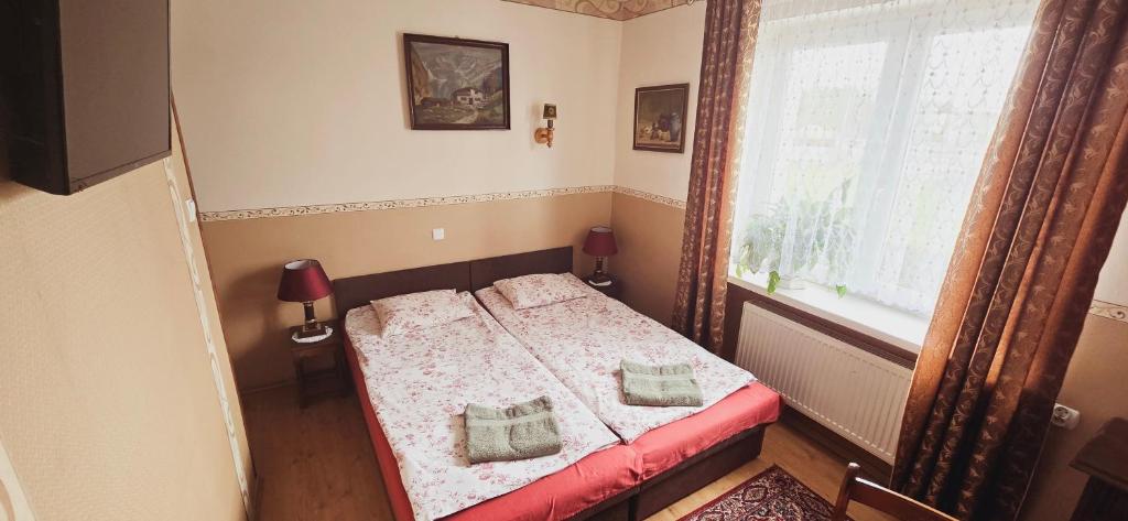 Postel nebo postele na pokoji v ubytování Willa Aida