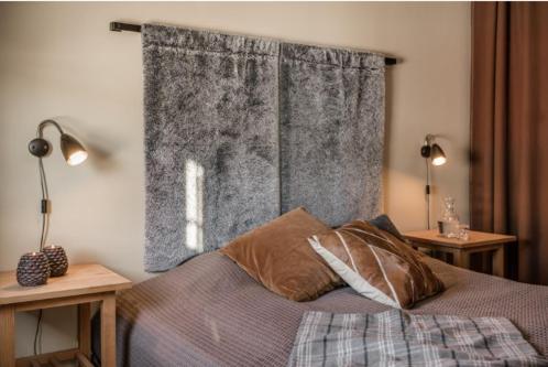 Una cama o camas en una habitación de Skistar Lodge Lindvallen