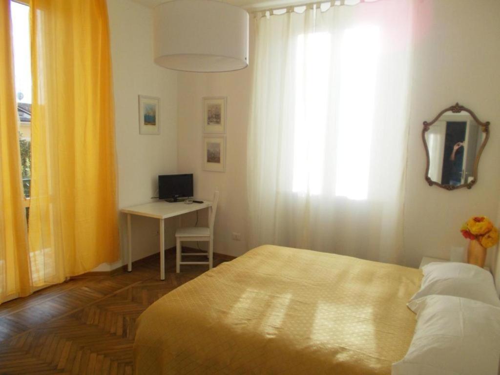 Postel nebo postele na pokoji v ubytování B&B ROSSANA