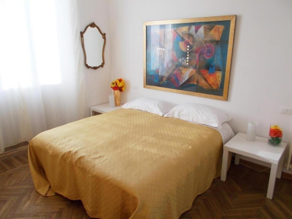 Postel nebo postele na pokoji v ubytování B&B ROSSANA