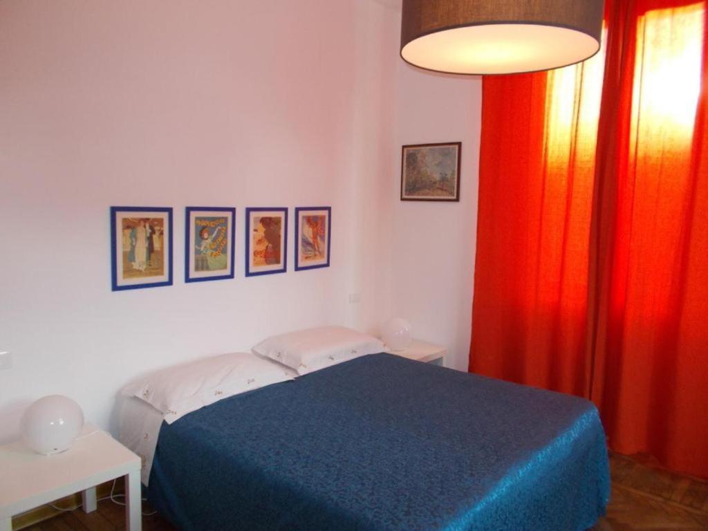 Postel nebo postele na pokoji v ubytování B&B ROSSANA