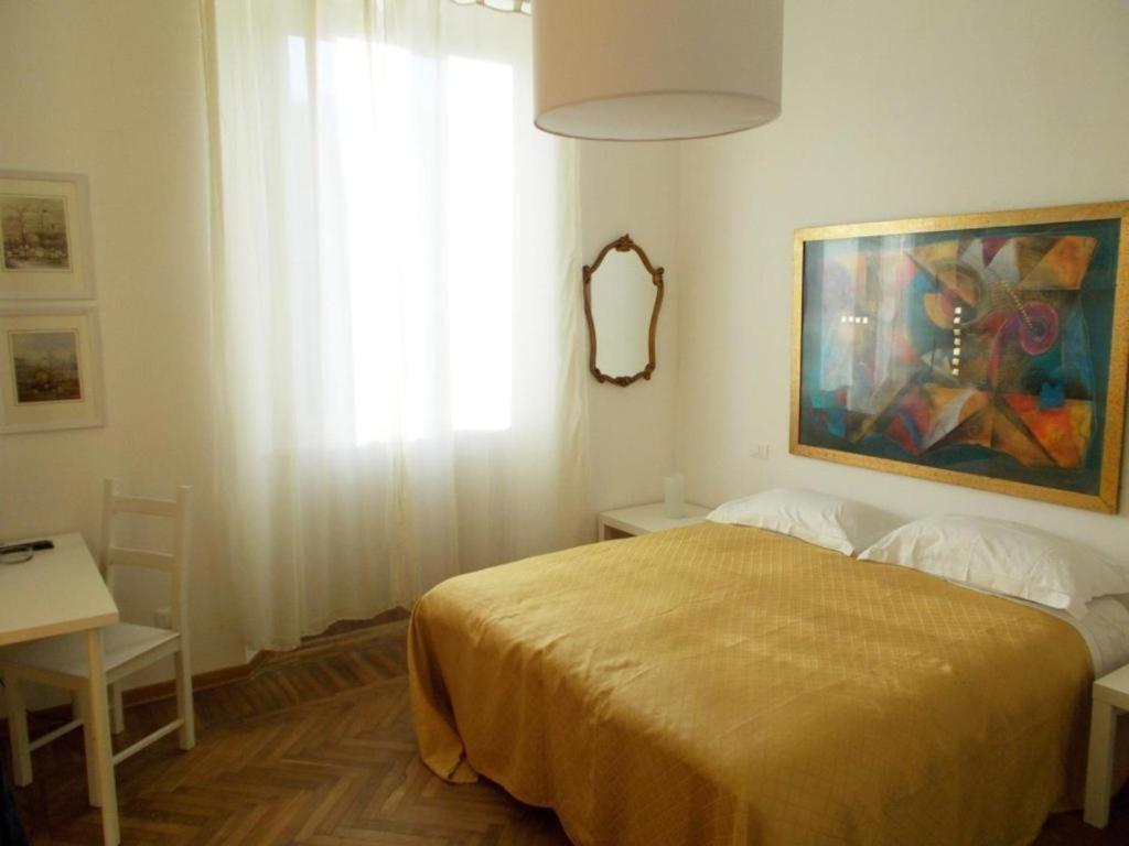 Postel nebo postele na pokoji v ubytování B&B ROSSANA