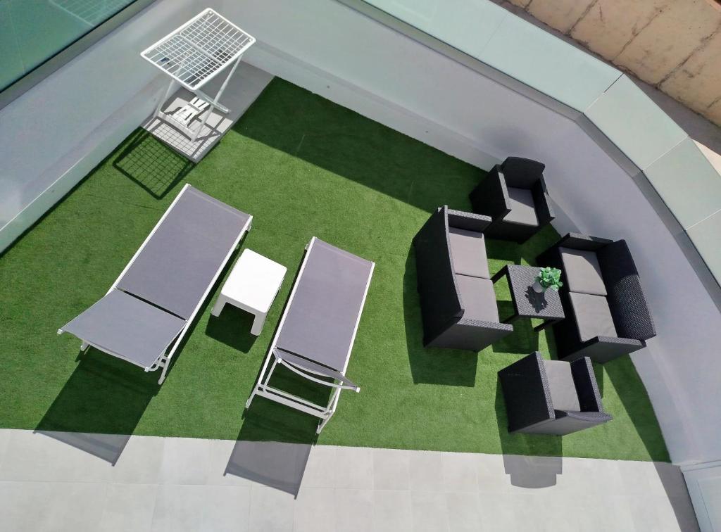 an overhead view of a room with chairs and tables at El Ramonal Vacacional in Candelaria