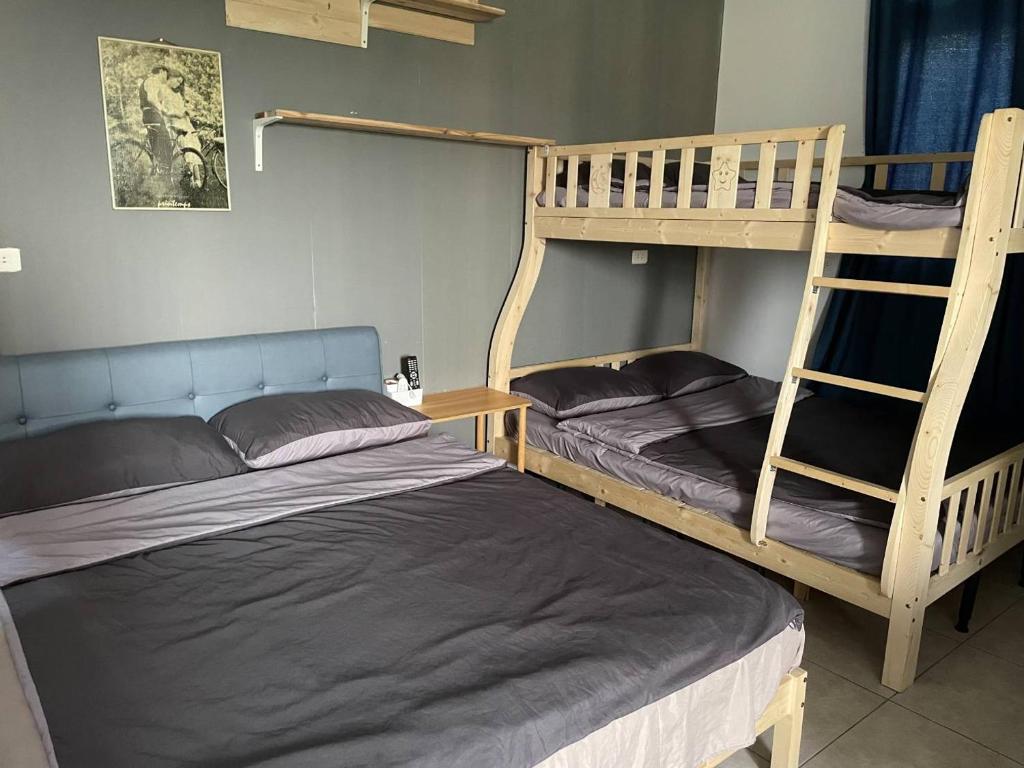 Postel nebo postele na pokoji v ubytování 阿布の家