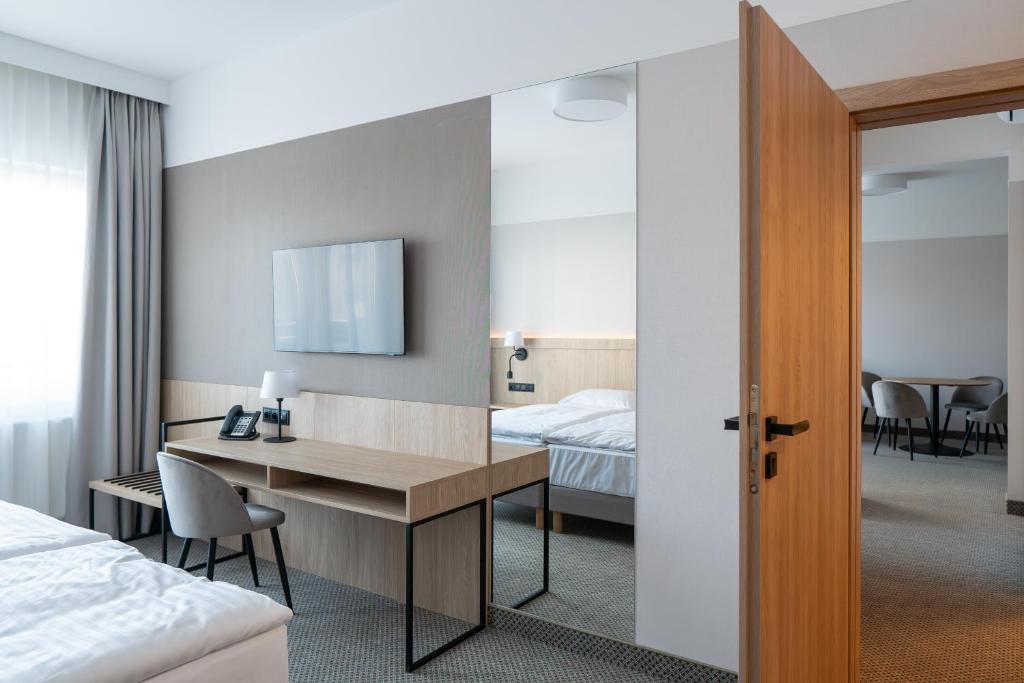 Postel nebo postele na pokoji v ubytování Hotel Continental