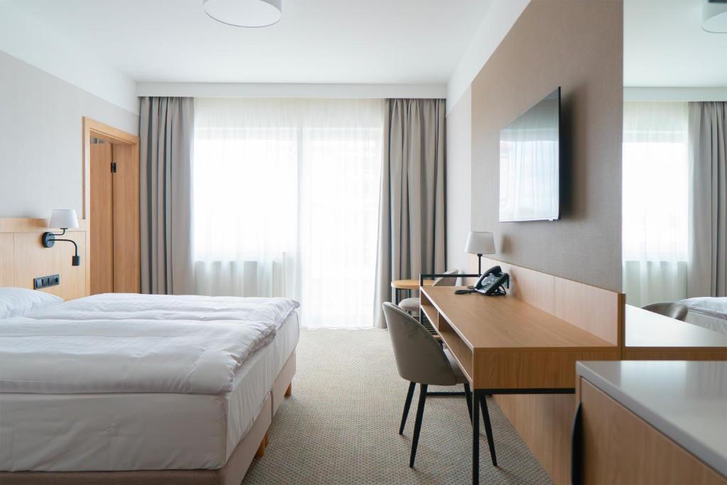 Postel nebo postele na pokoji v ubytování Hotel Continental