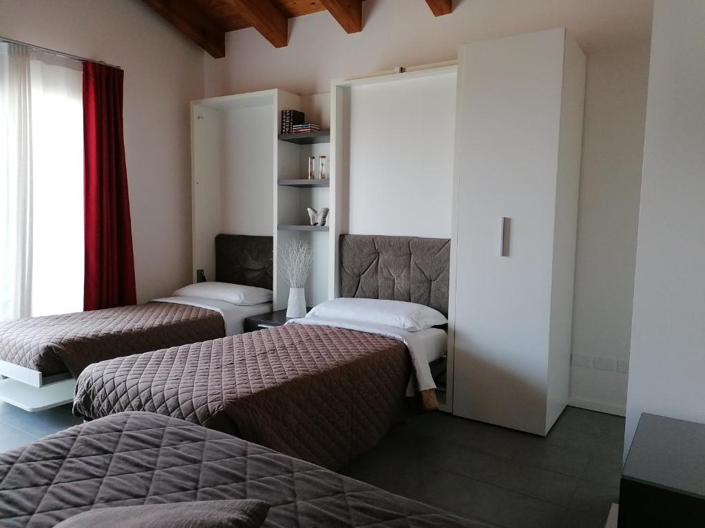 Postel nebo postele na pokoji v ubytování Ca' Belvedere