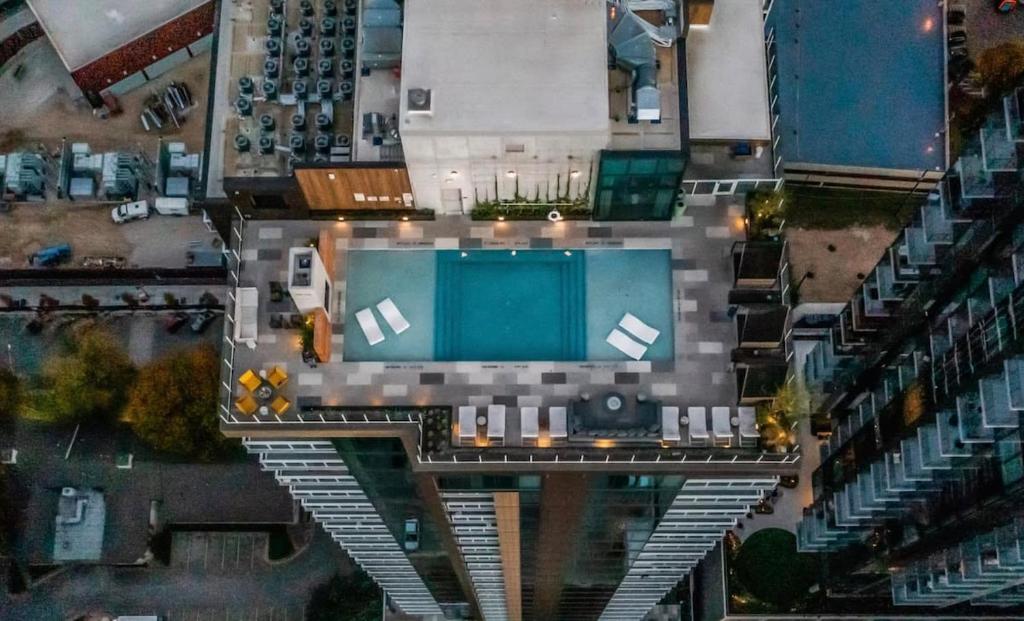 an overhead view of a building with a swimming pool at Luxury Oasis on Rainy Street in Austin