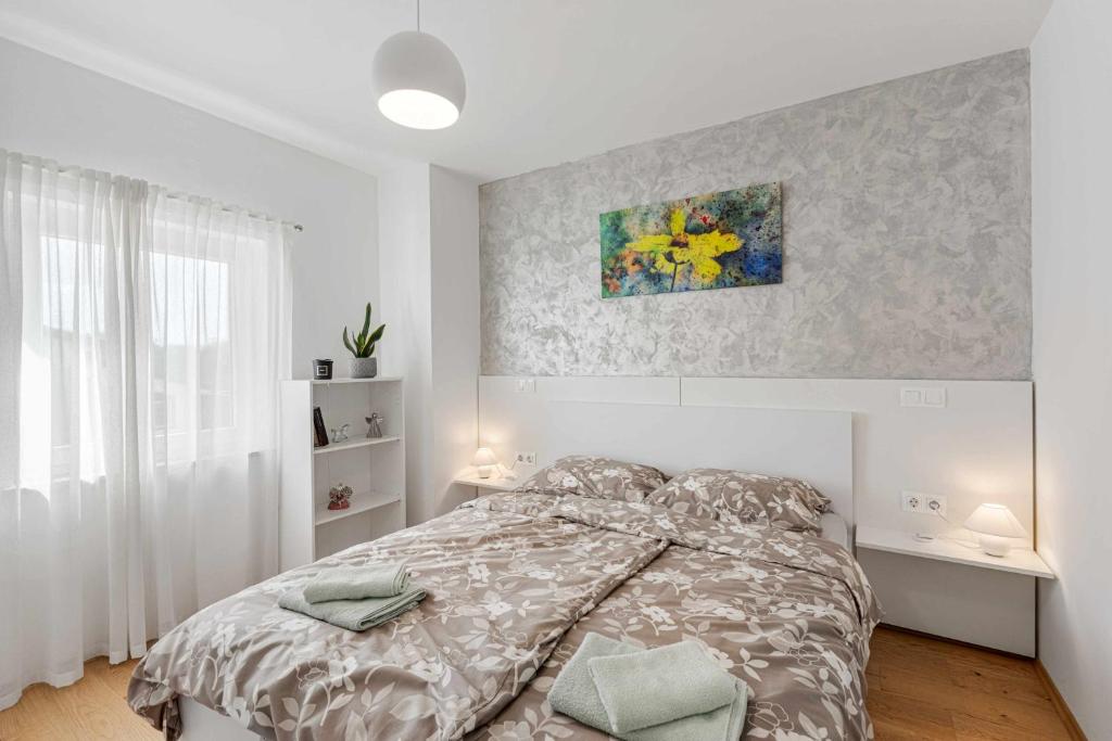 Postel nebo postele na pokoji v ubytování APP Vikili
