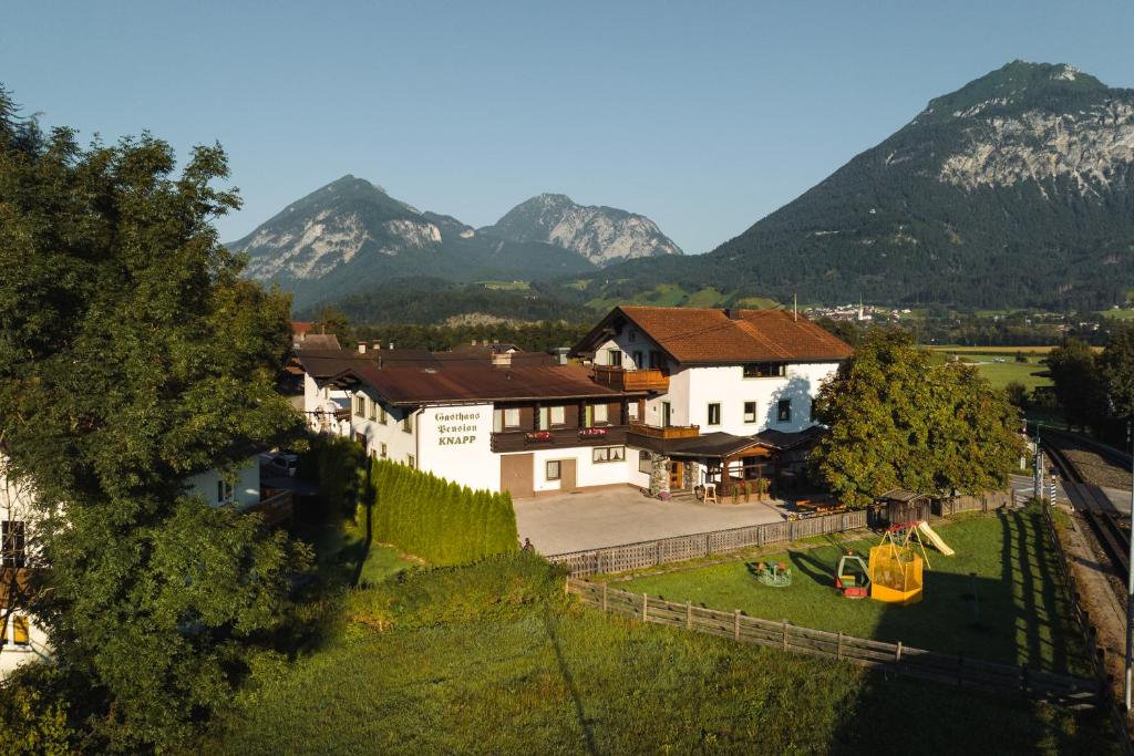 an aerial view of a house with mountains in the background at Gasthof Pension Knapp in Strass im Zillertal