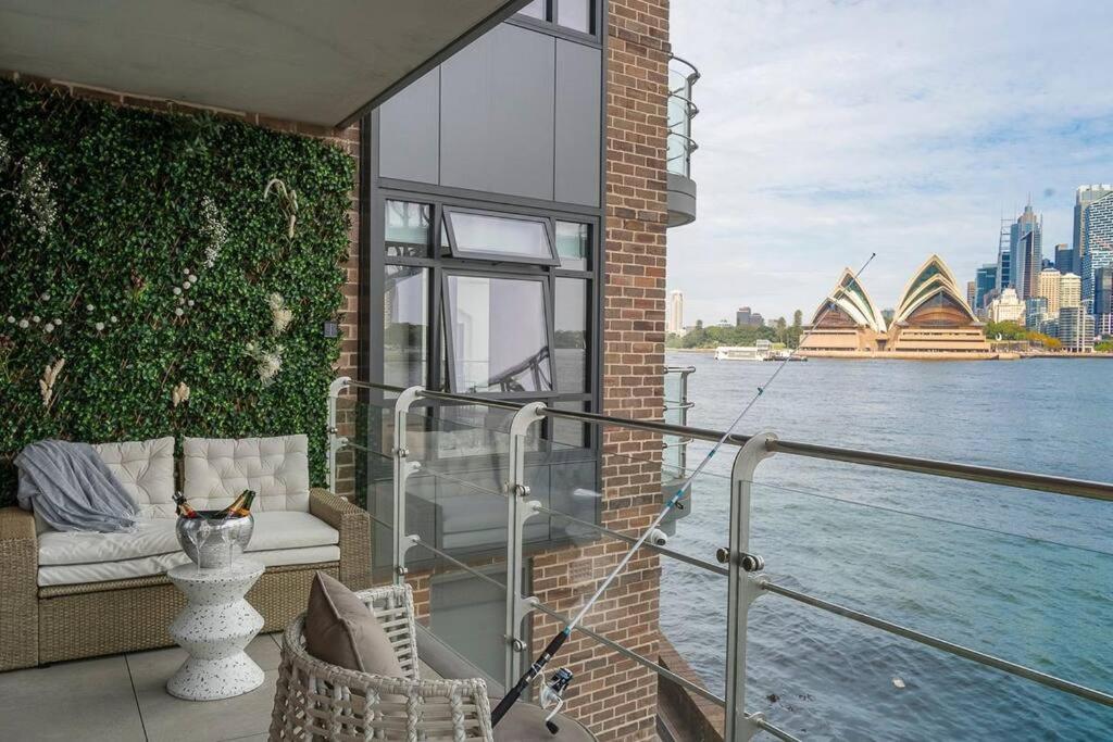 a balcony of a building with a view of the sydney city at Kirribilli Kanangra in Sydney