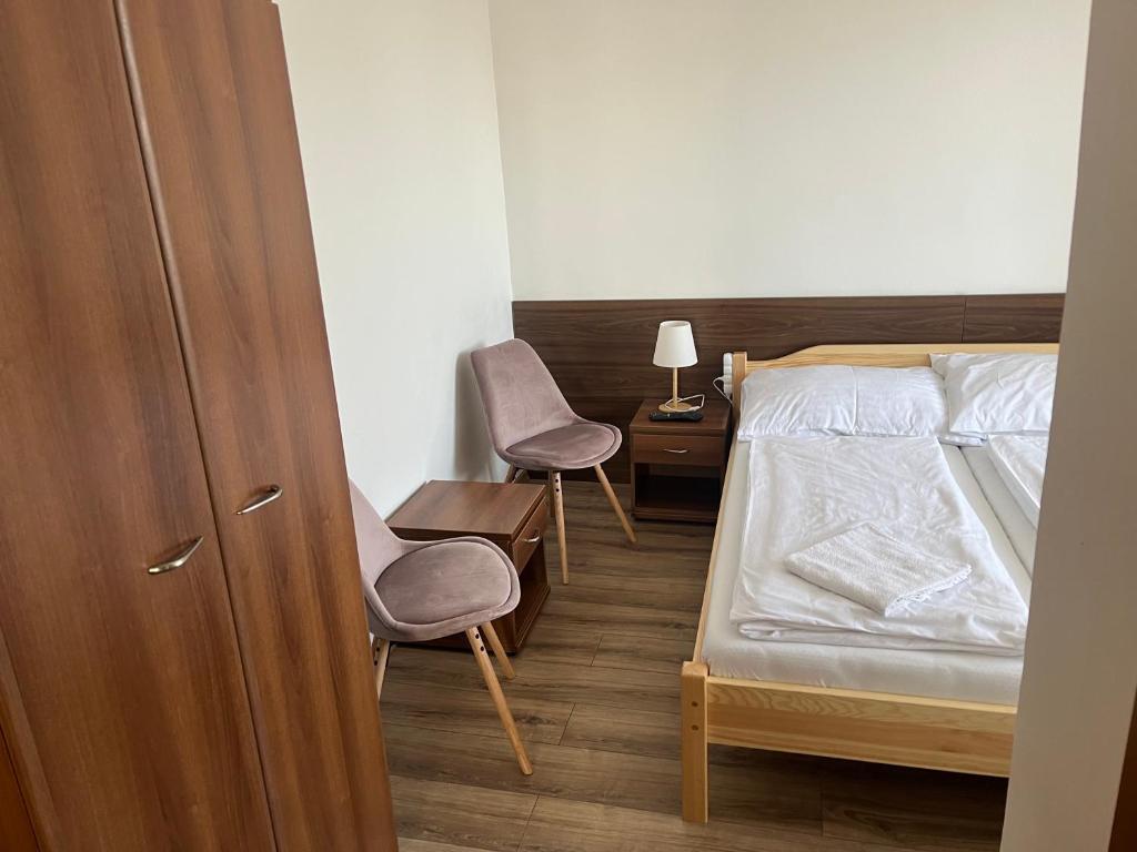 Postel nebo postele na pokoji v ubytování Penzion Znojmo