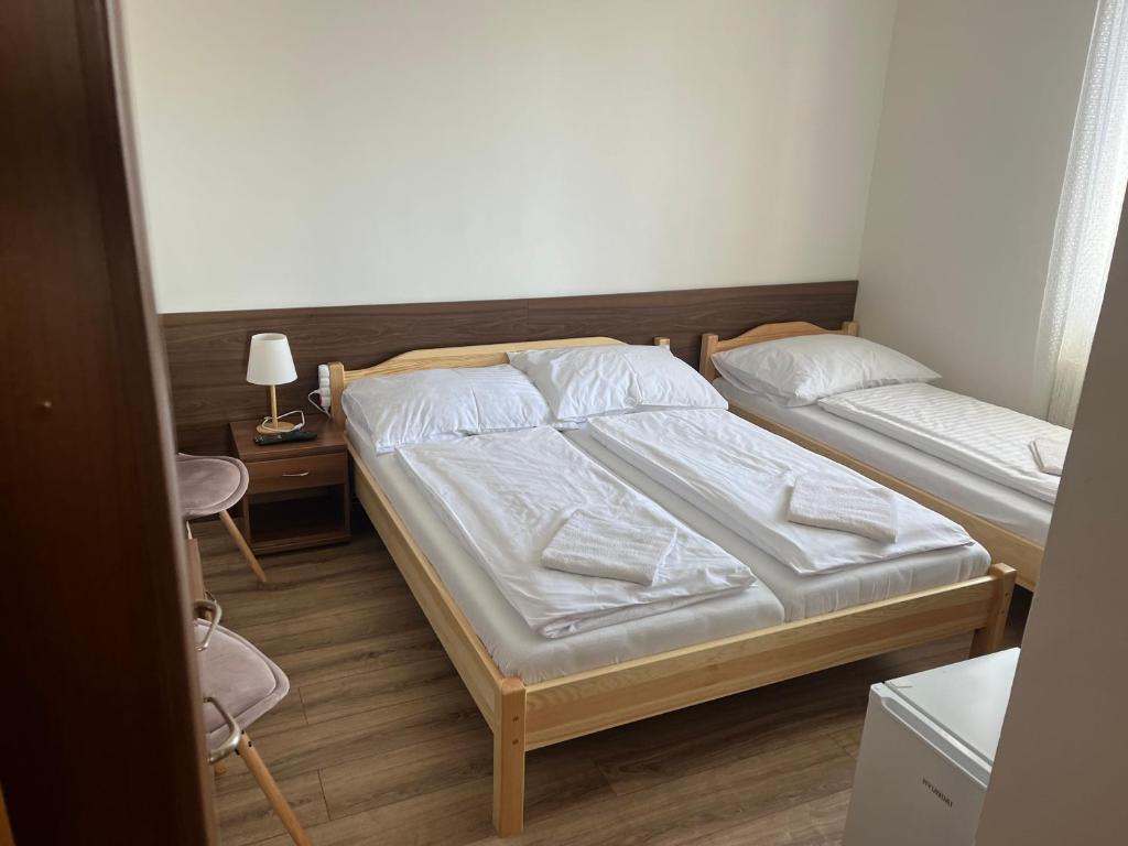 Postel nebo postele na pokoji v ubytování Penzion Znojmo