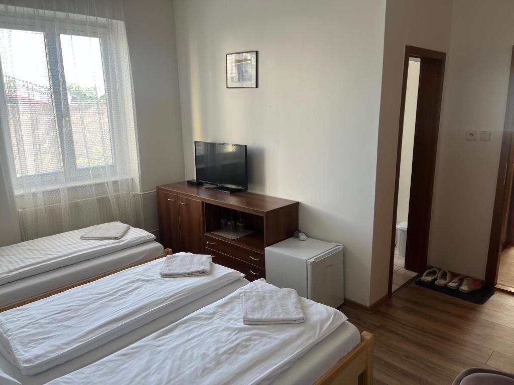 Postel nebo postele na pokoji v ubytování Penzion Znojmo