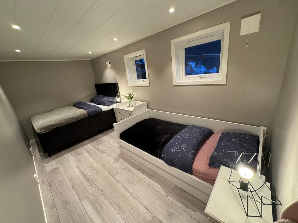 Postel nebo postele na pokoji v ubytování StarView Trolltunga Apartment