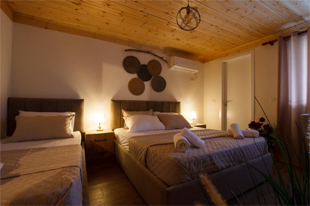 Postel nebo postele na pokoji v ubytování Guva Guest House