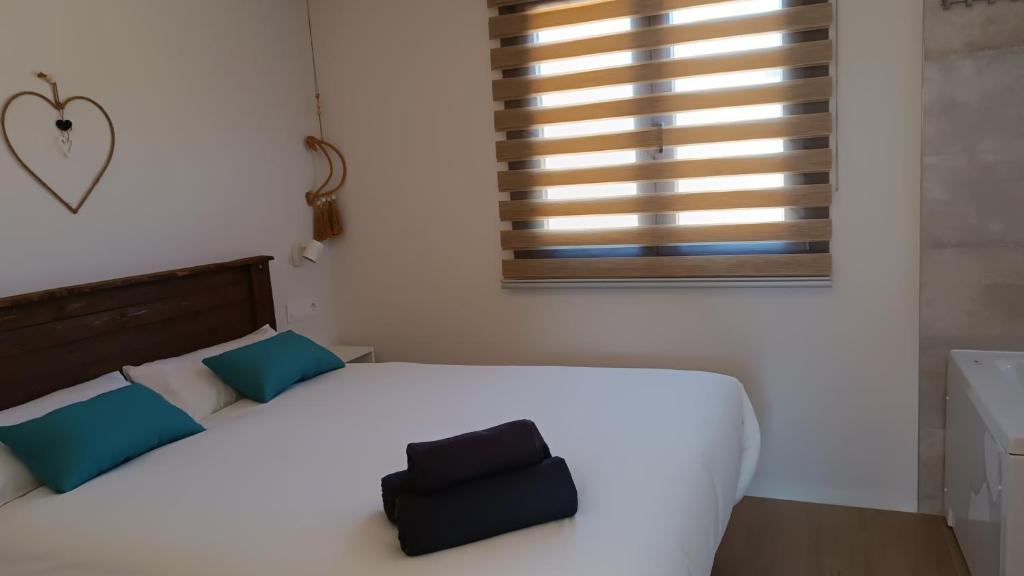 Postel nebo postele na pokoji v ubytování Casas Natura Suites