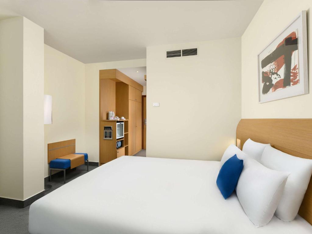 Postel nebo postele na pokoji v ubytování Novotel Budapest Danube
