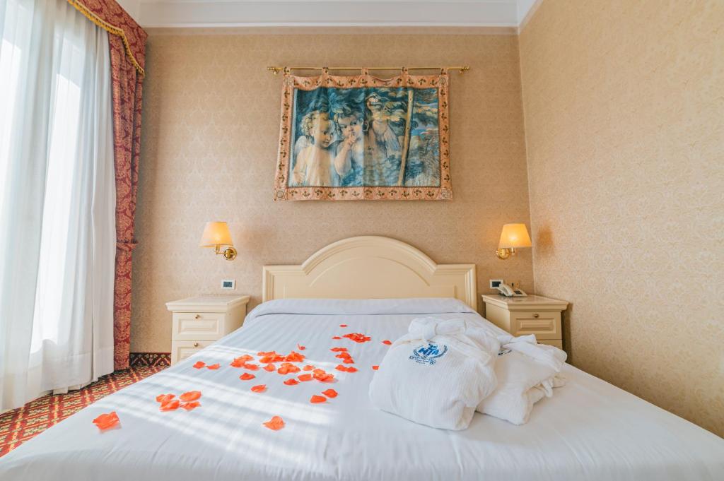 Postel nebo postele na pokoji v ubytování Hotel Terme Roma