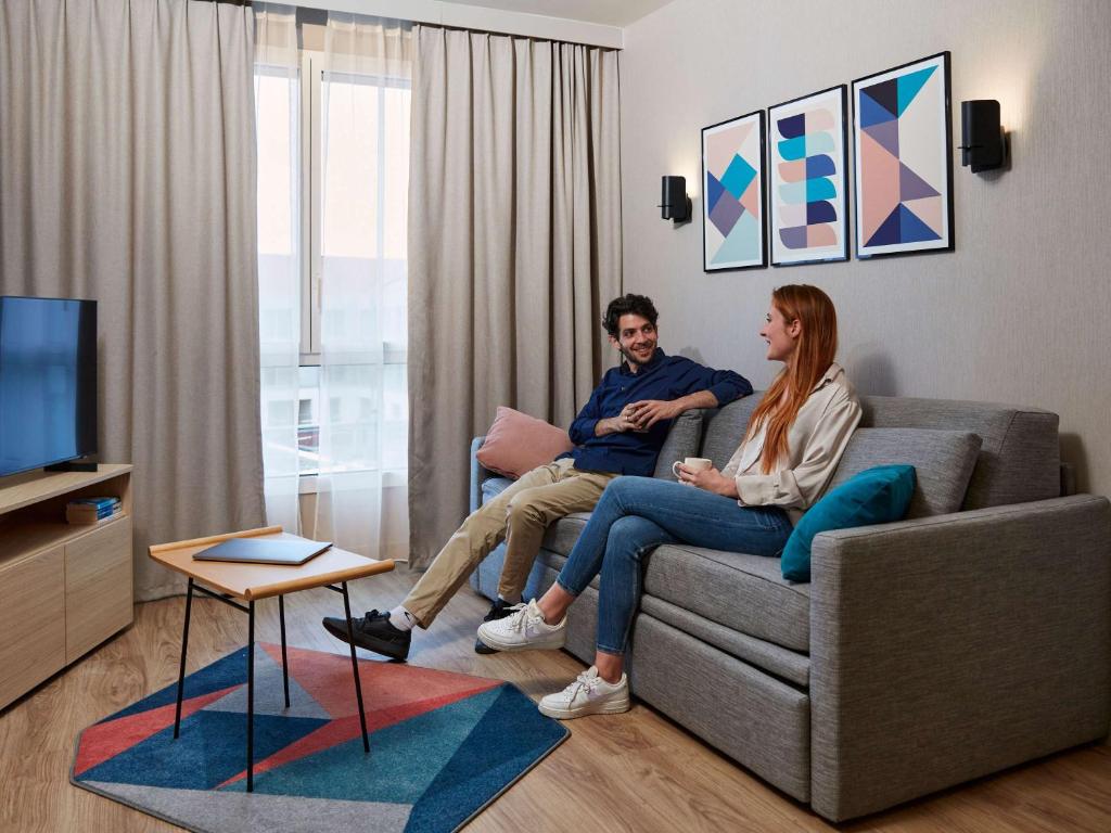 Aparthotel Adagio Original Toulouse Centre La Graveにあるテレビまたはエンターテインメントセンター