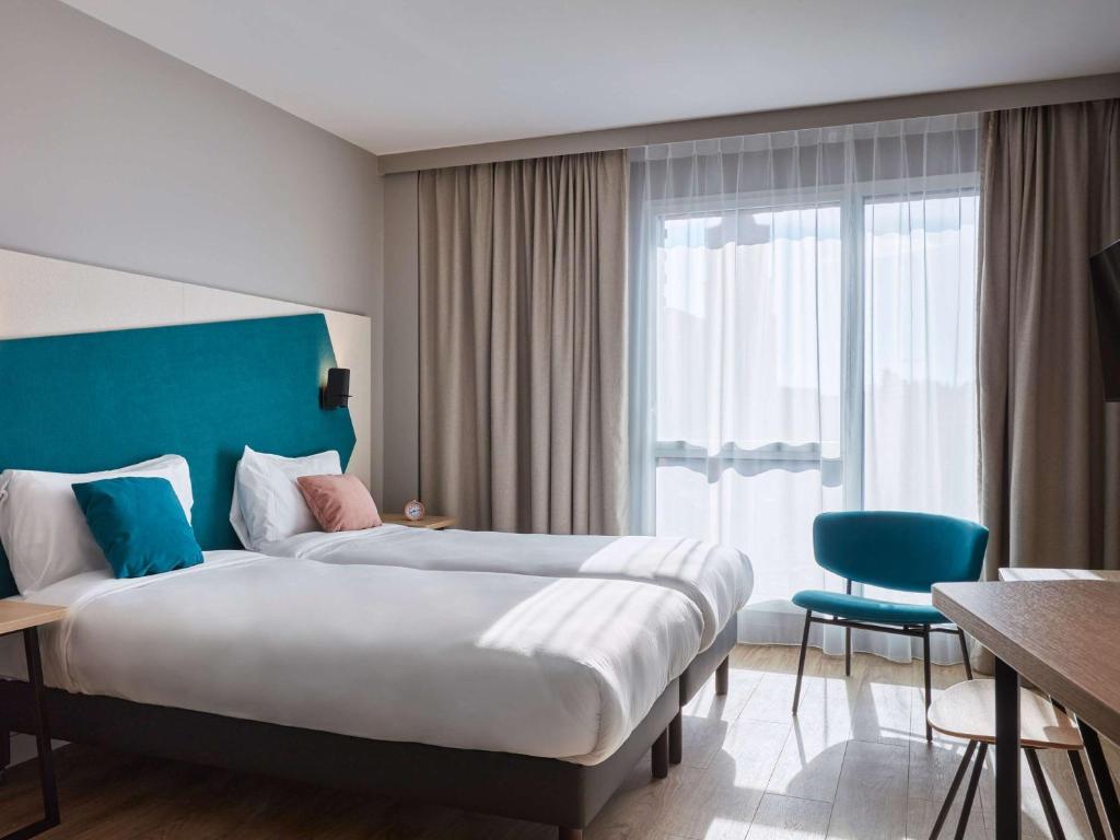 Aparthotel Adagio Original Toulouse Centre La Graveにあるベッド
