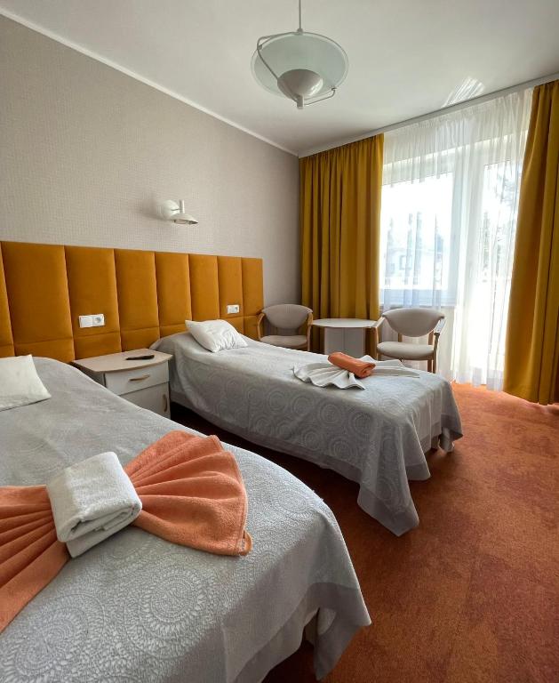 Postel nebo postele na pokoji v ubytování Damroka