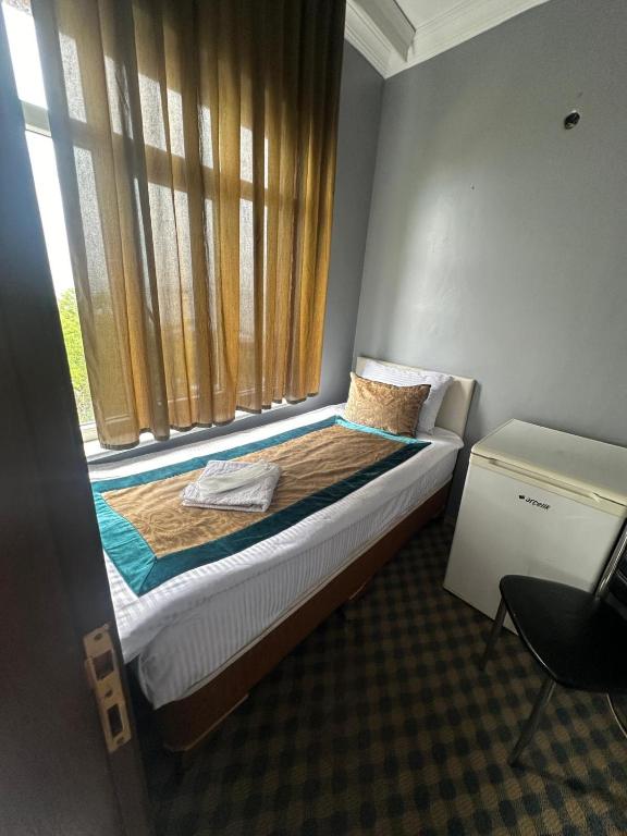 Postel nebo postele na pokoji v ubytování Happy Suite Boutique Hotel