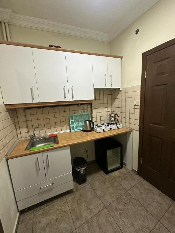 Kuchyň nebo kuchyňský kout v ubytování Happy Suite Boutique Hotel