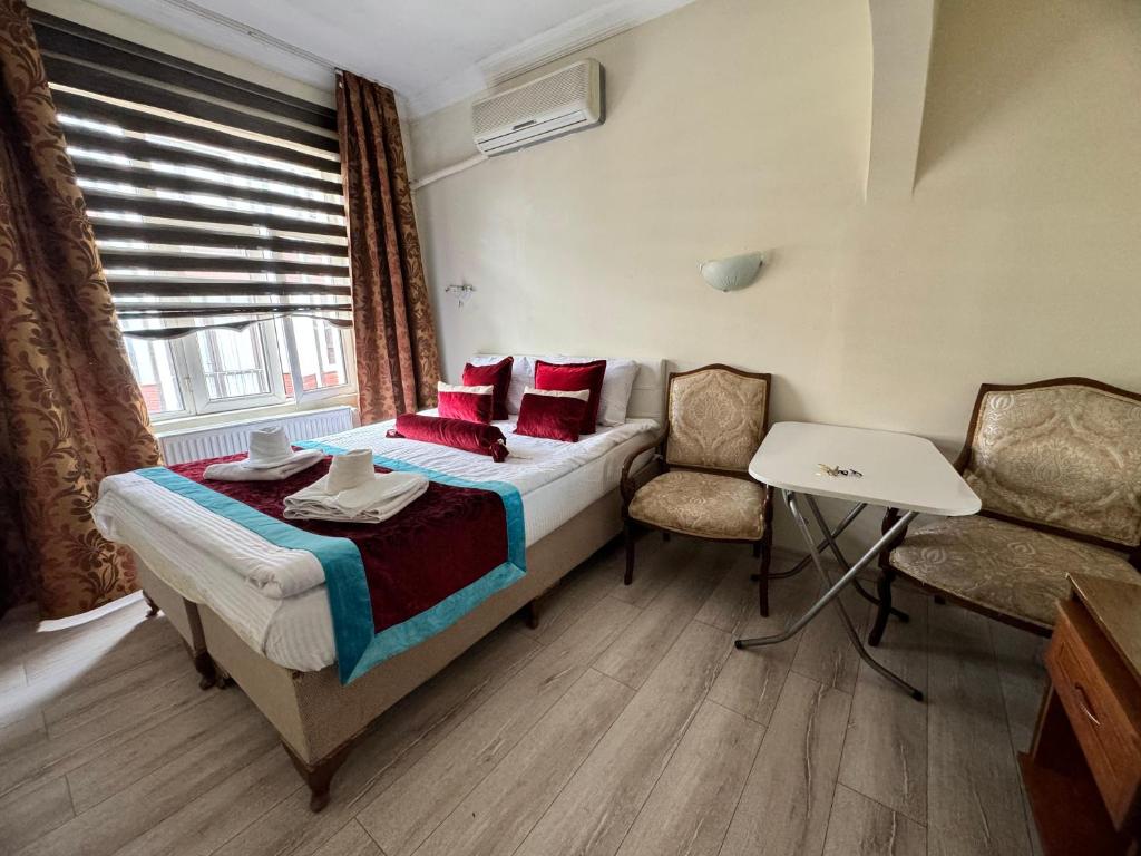 Postel nebo postele na pokoji v ubytování Happy Suite Boutique Hotel