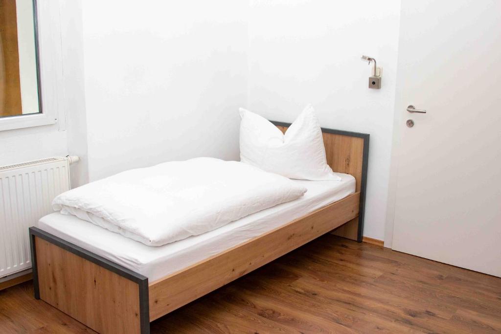 Postel nebo postele na pokoji v ubytování Roseggercafé