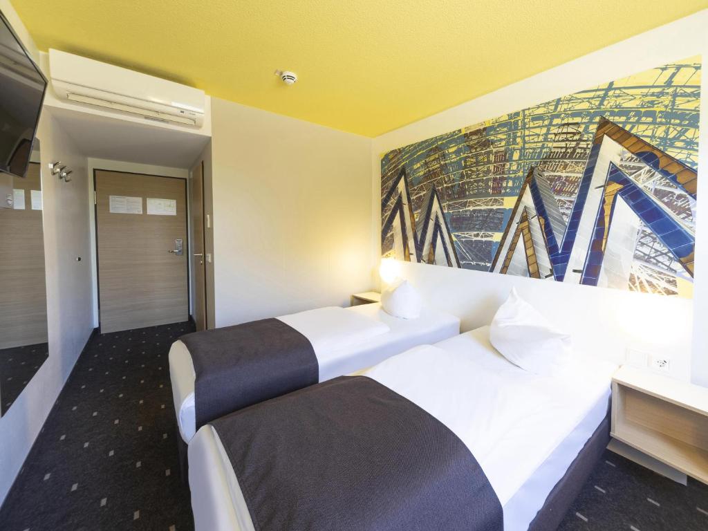 Postel nebo postele na pokoji v ubytování B&B Hotel Leipzig-Nord