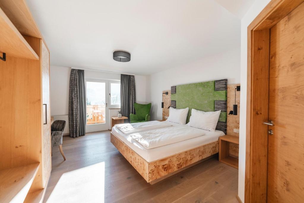 Posteľ alebo postele v izbe v ubytovaní Genusshotel Fichtenhof