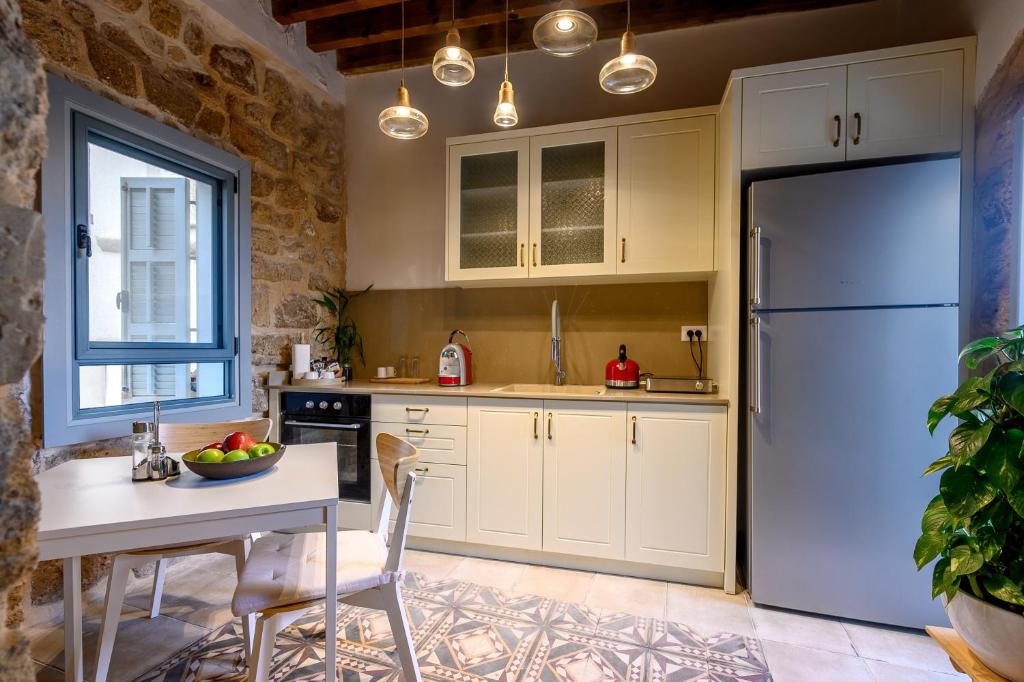 Kuchyň nebo kuchyňský kout v ubytování Siwar Boutique Suites