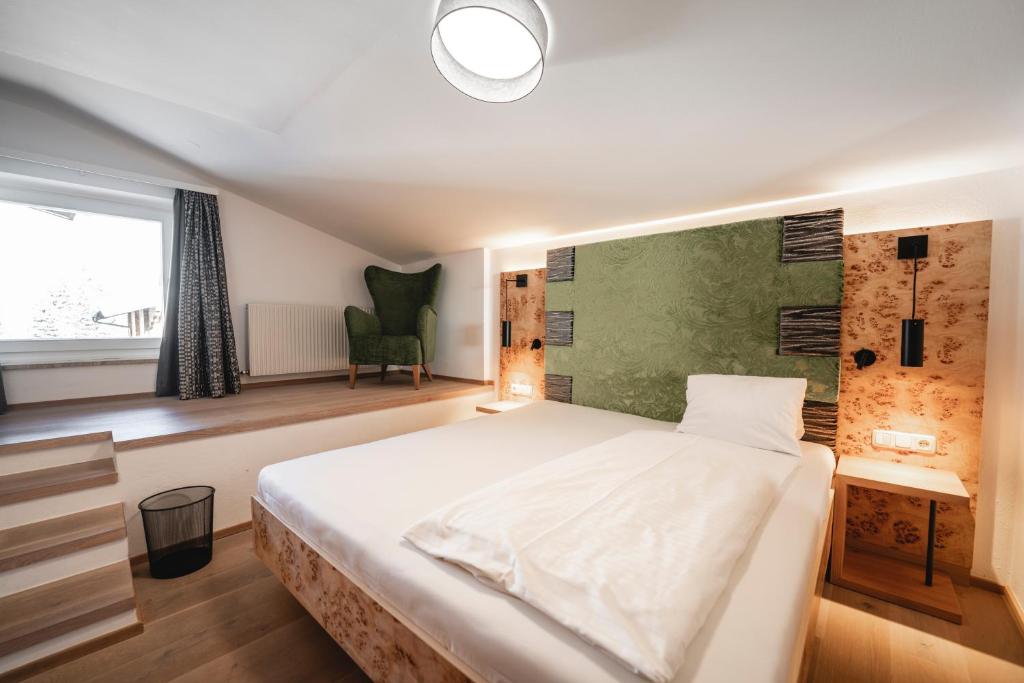 Posteľ alebo postele v izbe v ubytovaní Genusshotel Fichtenhof