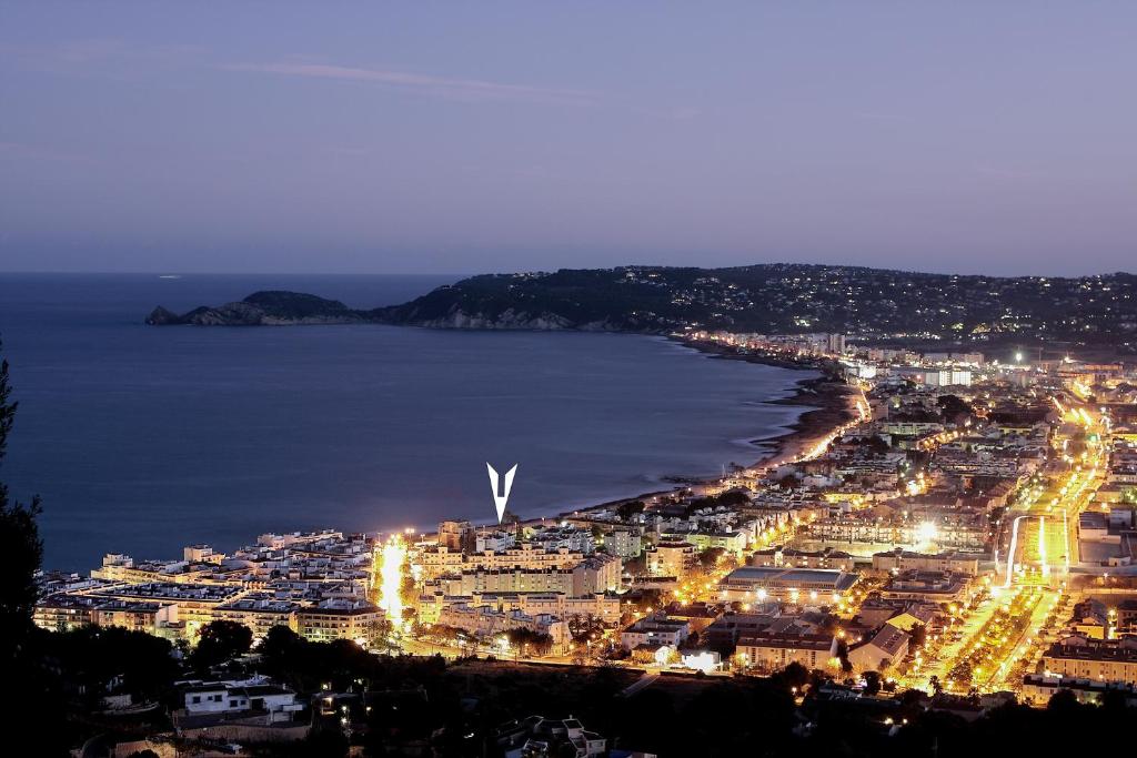 an aerial view of a city at night at Port de Xabia V in Jávea