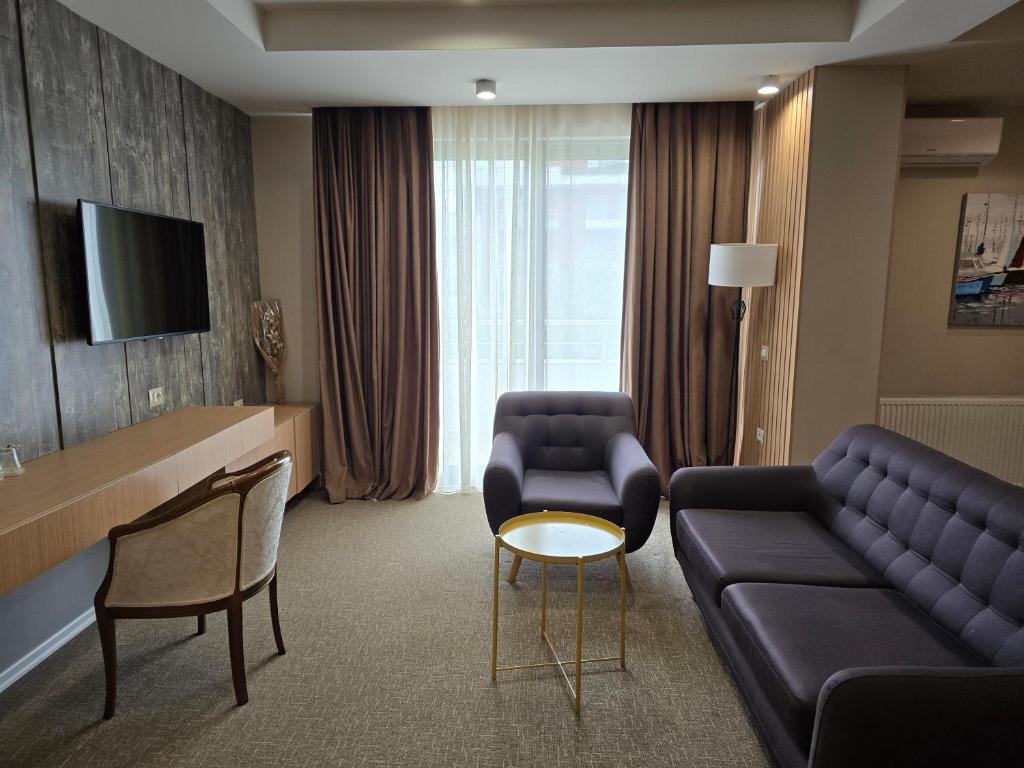 TV a/nebo společenská místnost v ubytování Perla Hotel
