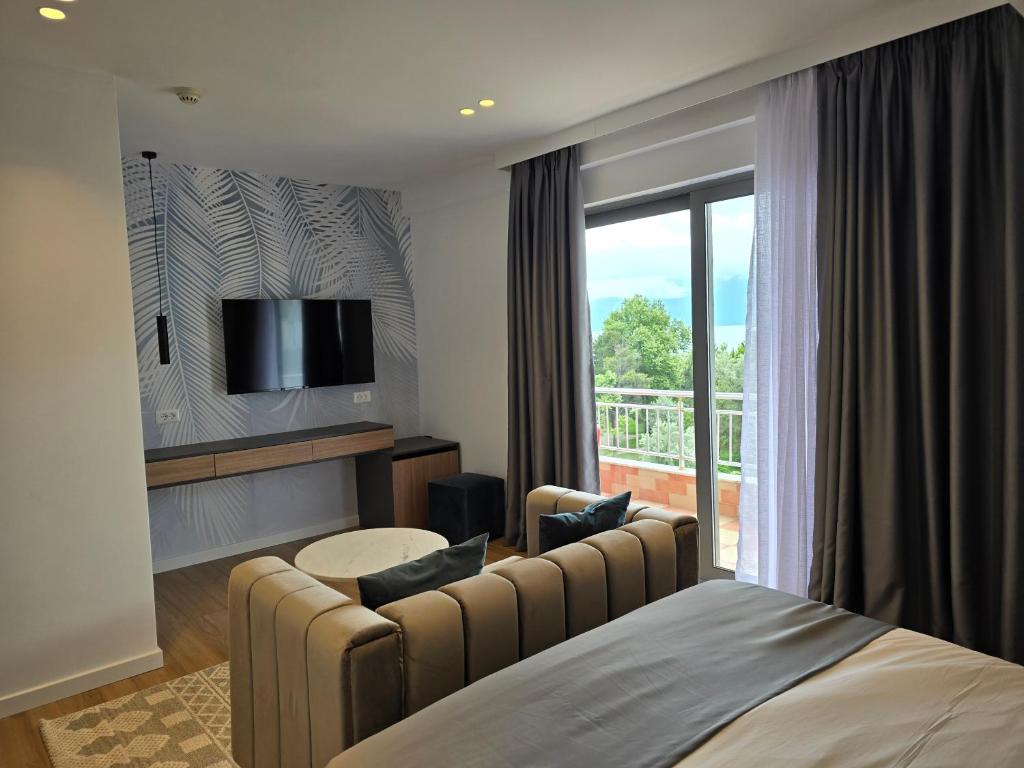 Postel nebo postele na pokoji v ubytování Perla Hotel