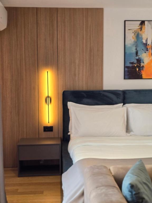 Postel nebo postele na pokoji v ubytování Perla Hotel