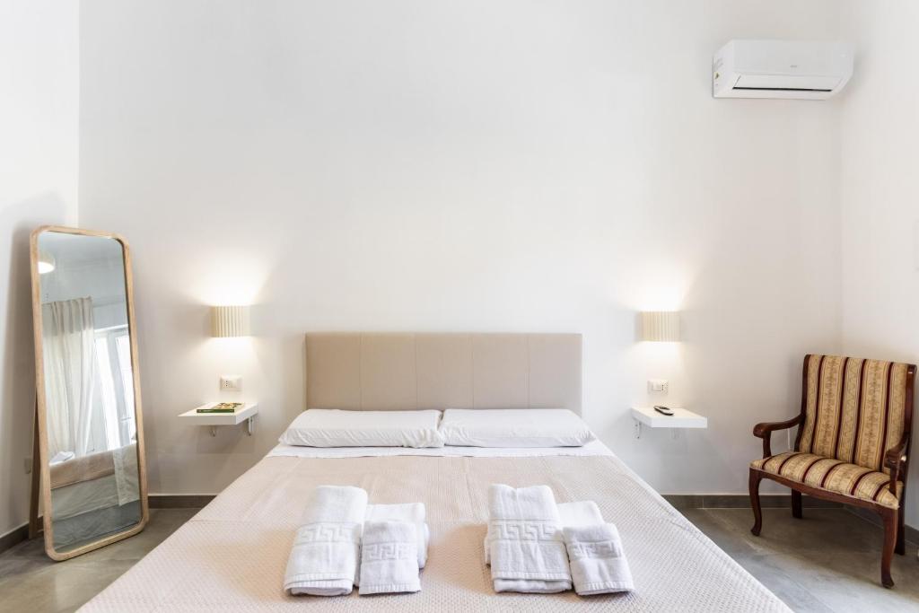 Ένα ή περισσότερα κρεβάτια σε δωμάτιο στο Il Moro Rooms