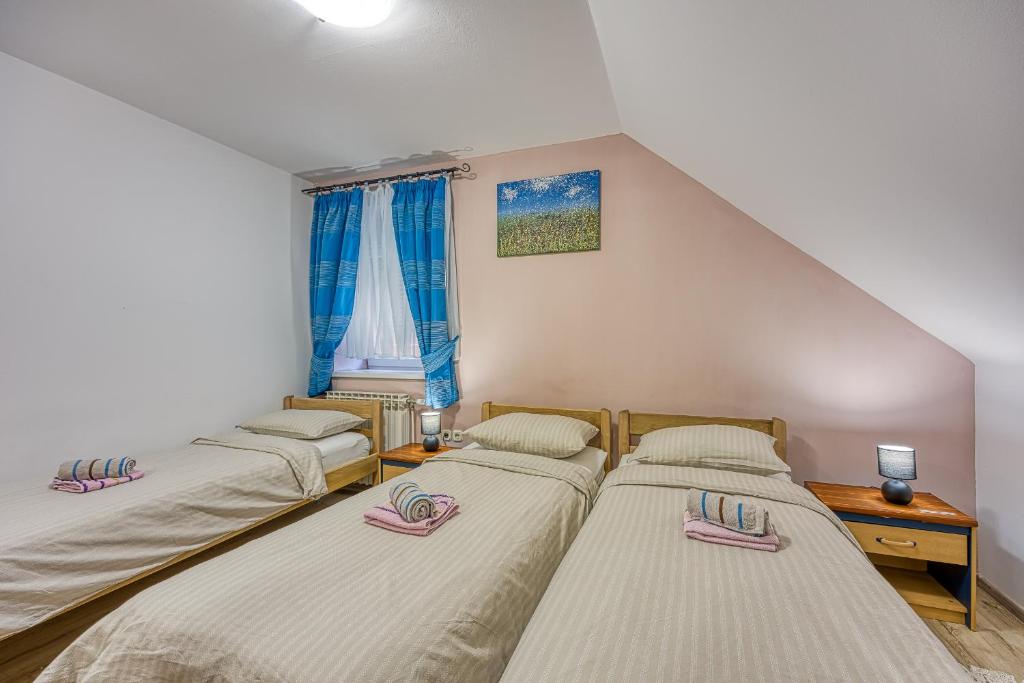 Postel nebo postele na pokoji v ubytování Rooms Centar
