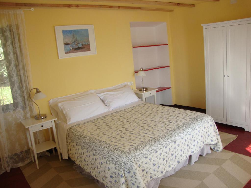 Postel nebo postele na pokoji v ubytování Residenza Erbaluna