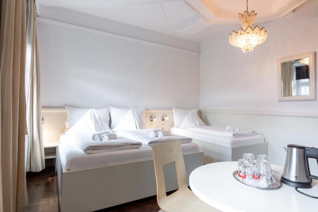 Postel nebo postele na pokoji v ubytování EKONO By Leva Hotel Strasser