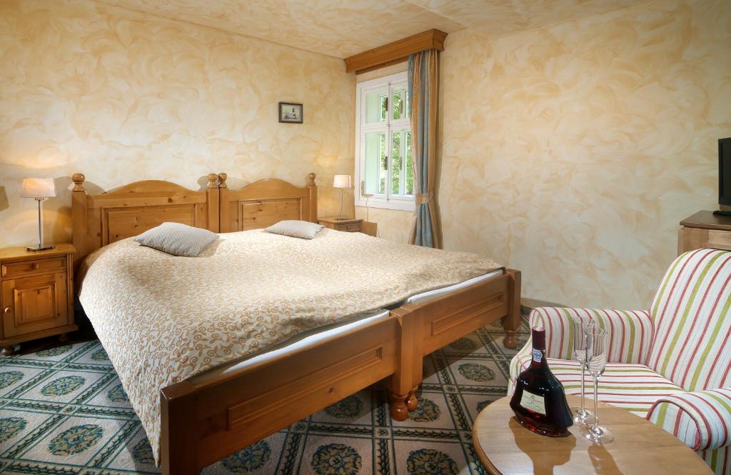 Postel nebo postele na pokoji v ubytování Hotel Pod Jasany